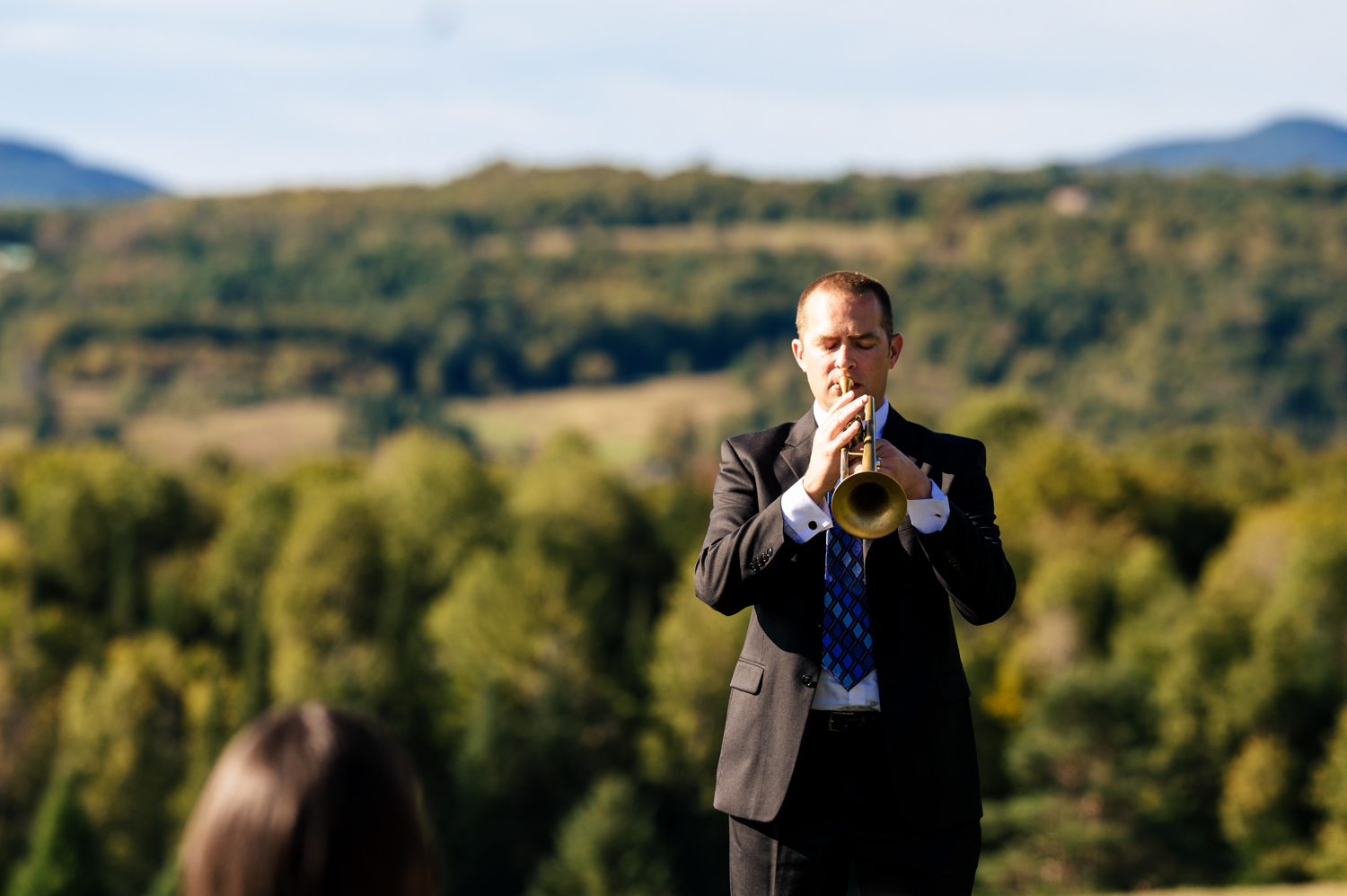 Mountainside trumpet solo during Vermont wedding ceremony.